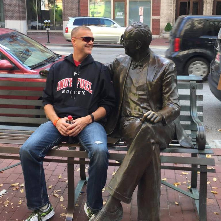 Dennis sitting on bench